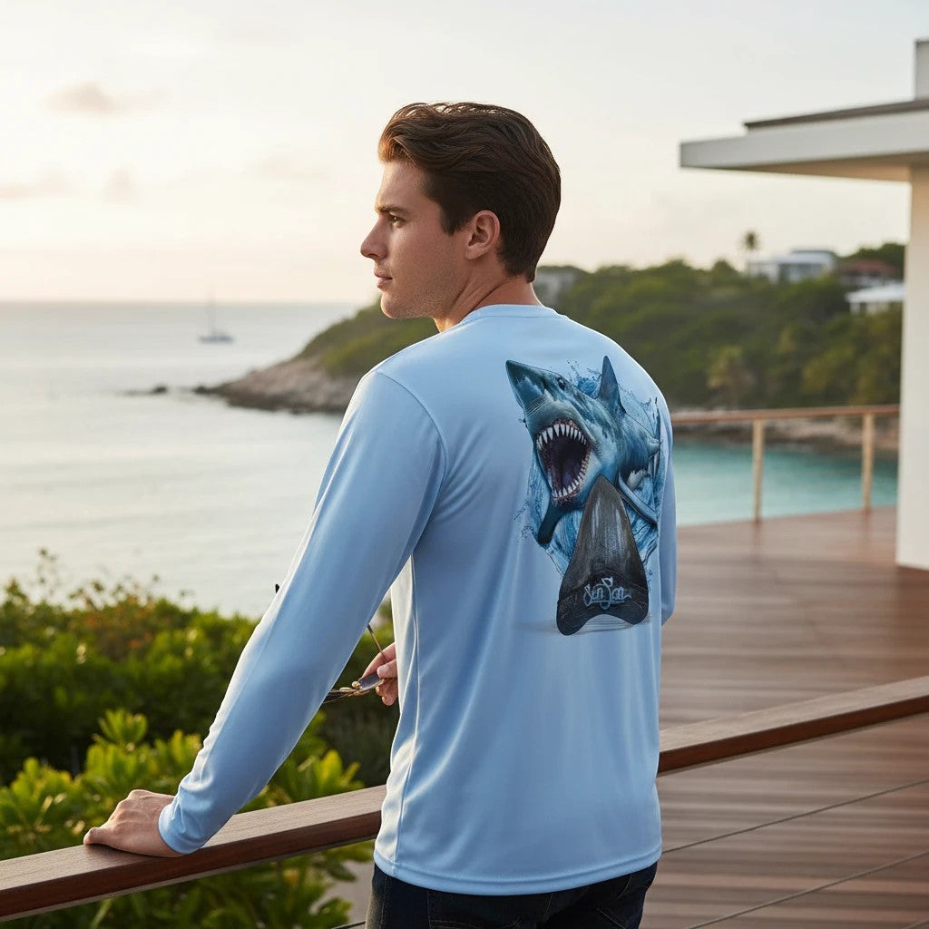 Sea Fear light blue long sleeve performance tee with a detailed Megalodon shark graphic on the back, worn by a man.